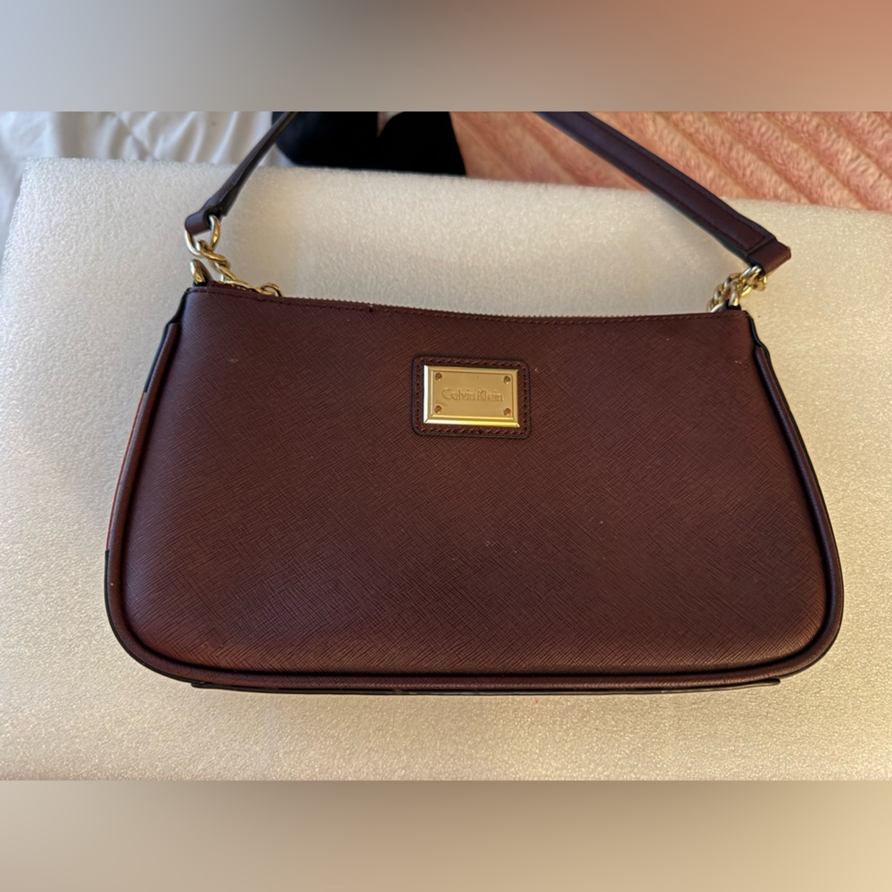 Classic Calvin Klein Aberdeen Saffiano Demi Bag in Burgundy.